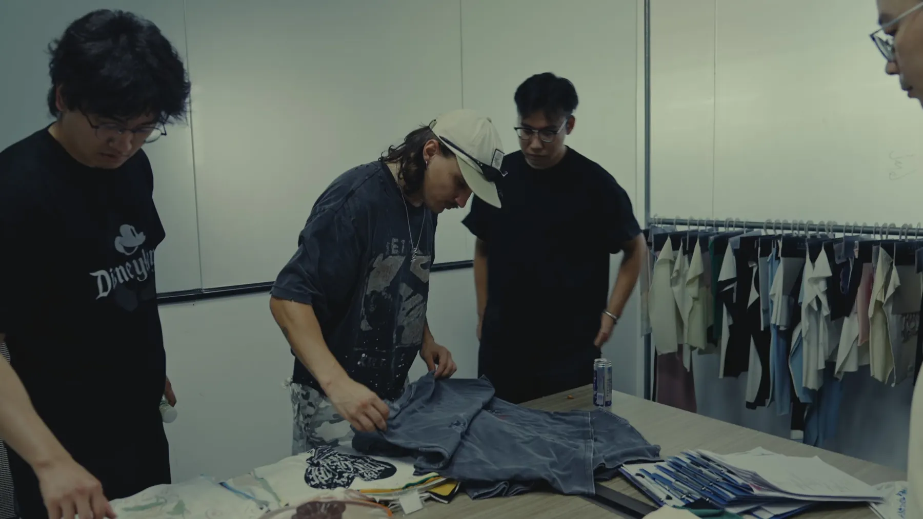 Alrightmade team checking finished garment samples for a client