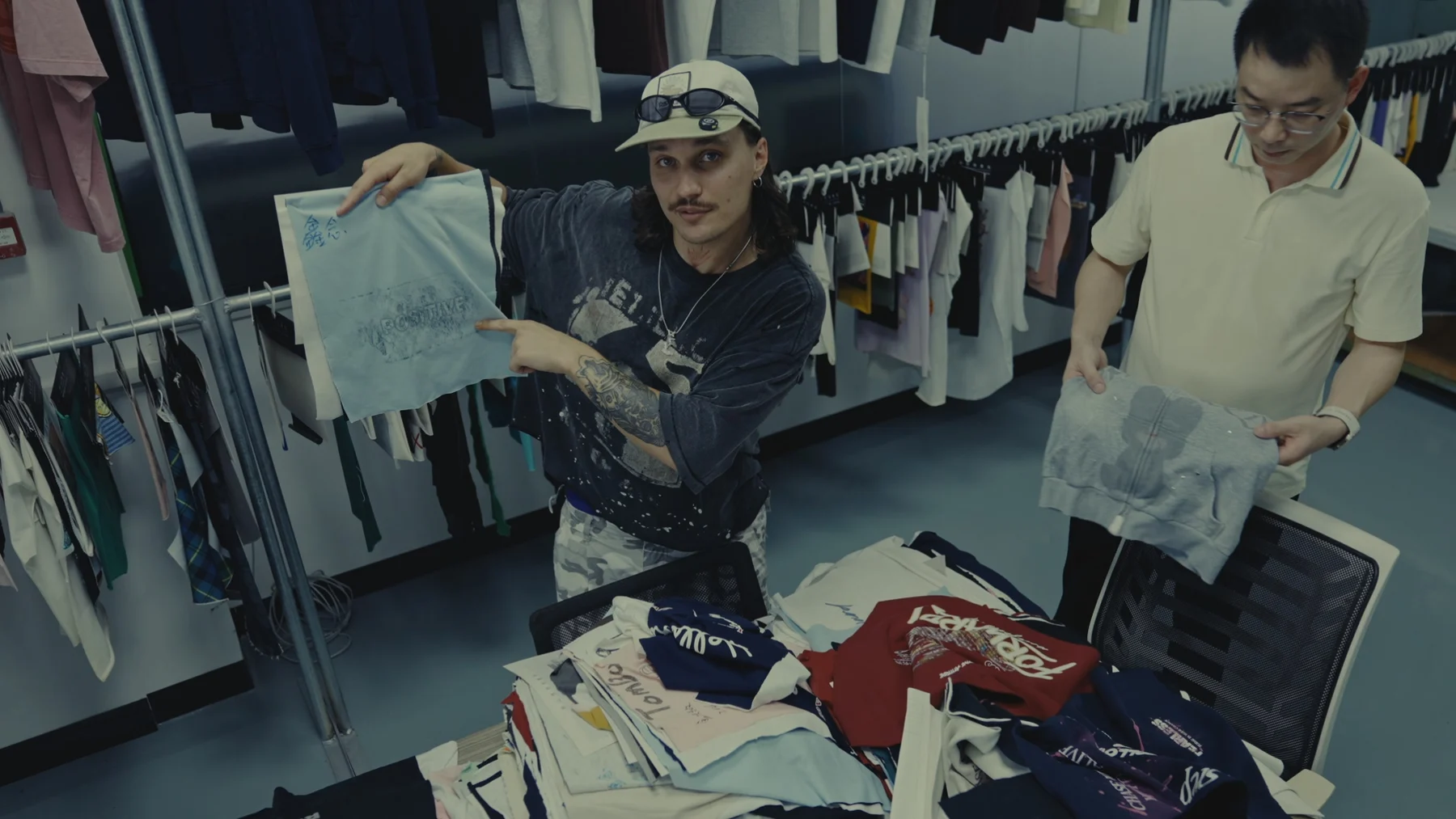 Founders reviewing garment samples and fabric swatches