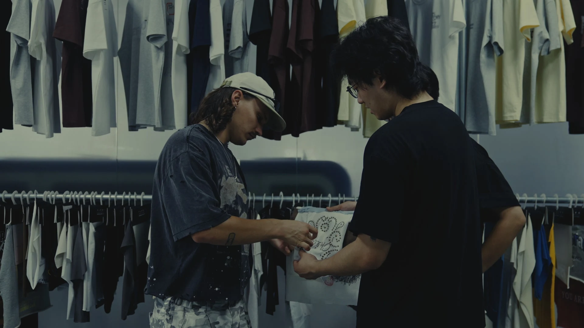 Apparel team reviewing a printed garment sample