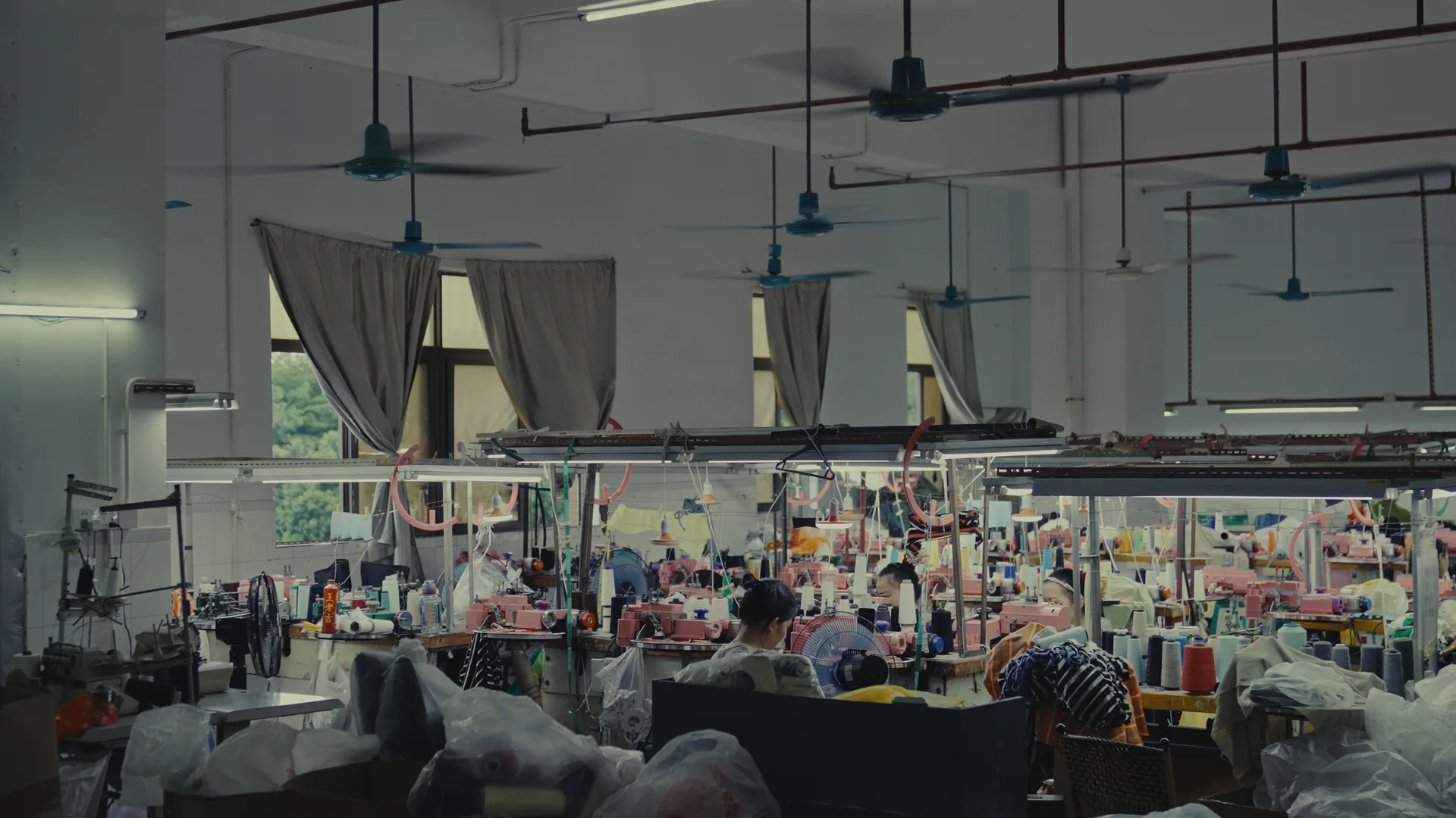 Knitted garment production floor with sewing workstations