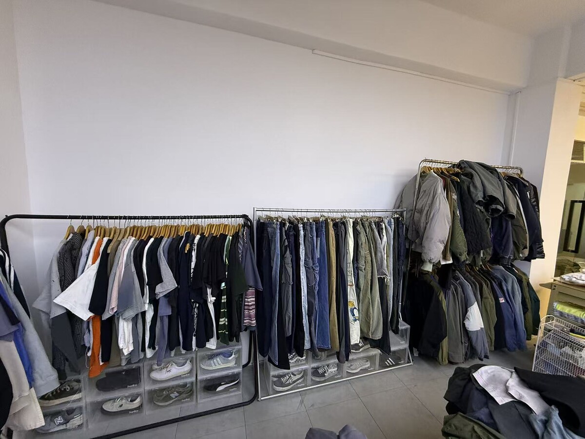 Garment samples and developed styles displayed inside the company sample room