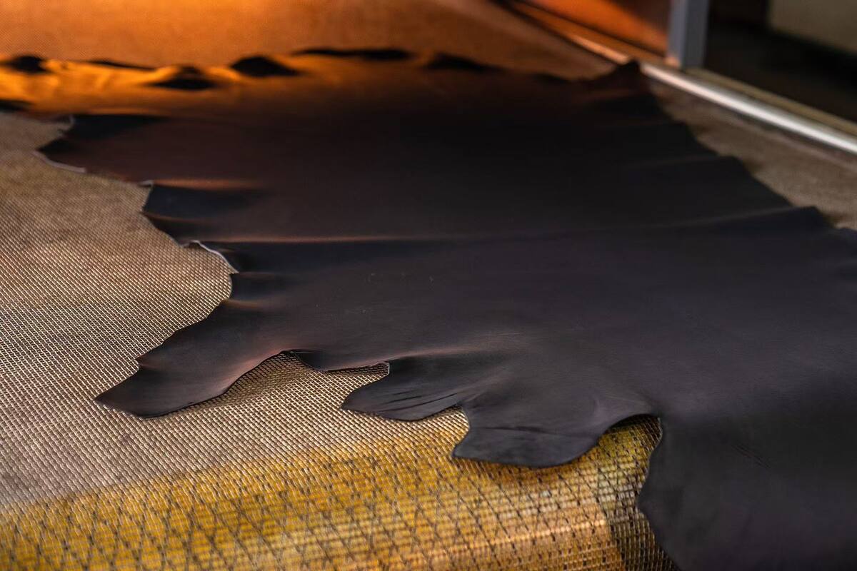 Finished black leather laid out for material inspection