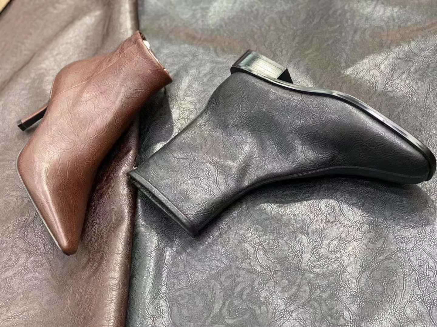 Leather footwear samples on varied leather surfaces